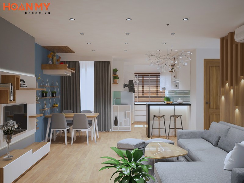 Phòng khách chung cư thiết kế liền bếp sử dụng gỗ tự nhiên thô mang đến sự nhẹ nhàng, tinh tế và vô cùng uyển chuyển