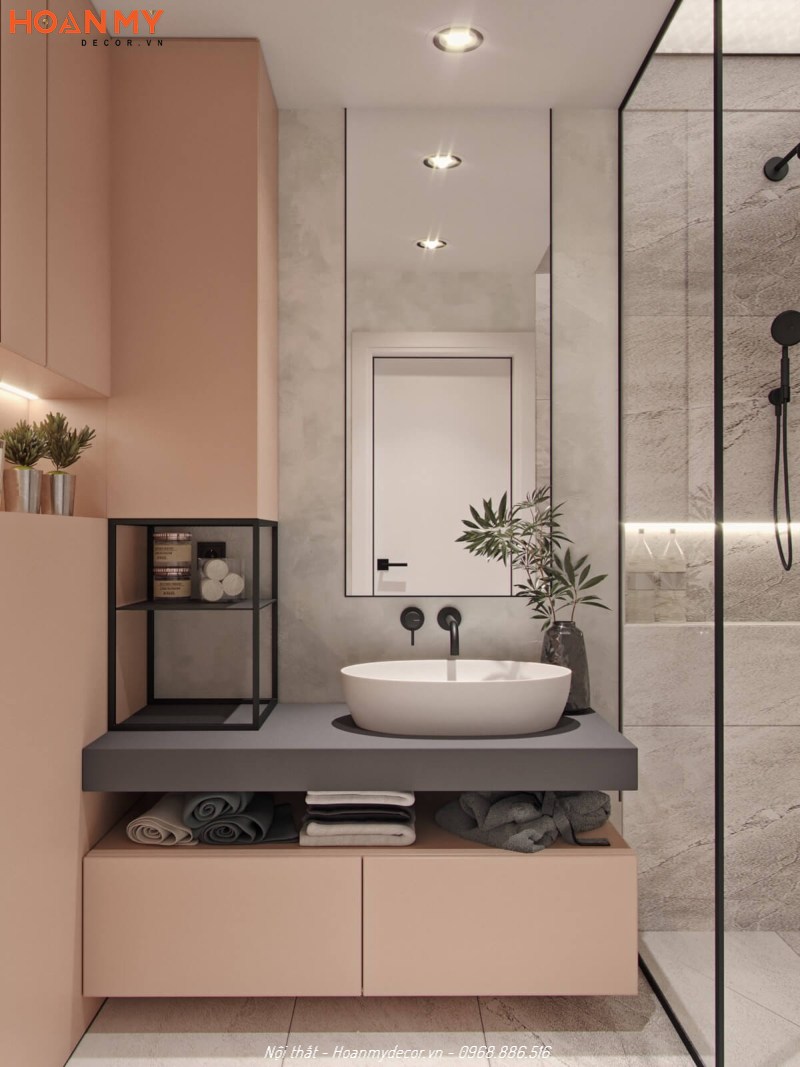 Bố trí gương treo tường cỡ lớn tạo sự rộng rãi cho không gian nhà tắm